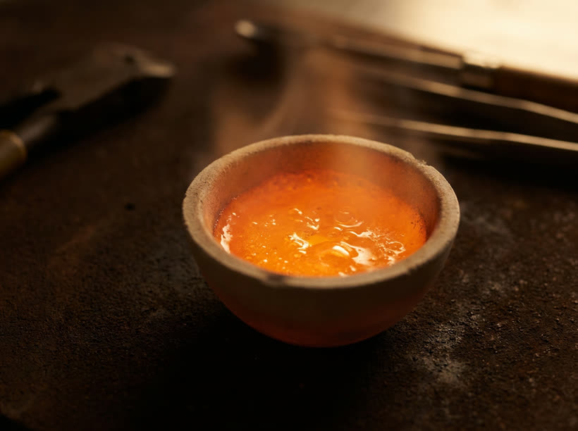 Bone-ash melting under heat and pressure, a warm glow
